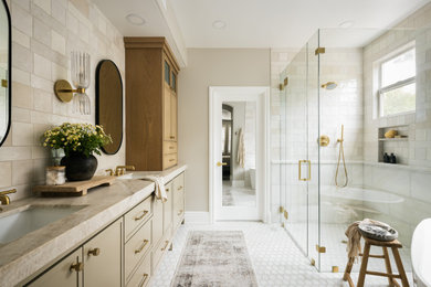 Freestanding bathtub - mid-sized transitional master beige tile and ceramic tile marble floor, double-sink and white floor freestanding bathtub idea in Orange County with shaker cabinets, beige cabinets, beige walls, an undermount sink, quartzite countertops, a hinged shower door, beige countertops, a niche and a built-in vanity