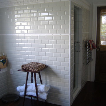Bathroom with walk-in shower and towel warmer