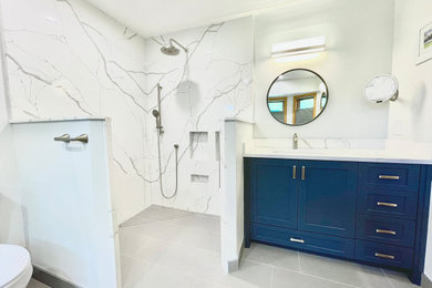 Large arts and crafts master porcelain tile and gray floor bathroom photo in Minneapolis with a niche and quartzite countertops