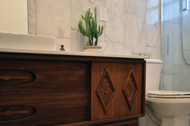 Inspiration for a contemporary master white tile and marble tile marble floor and gray floor bathroom remodel in Miami with furniture-like cabinets, brown cabinets, a two-piece toilet, white walls, a vessel sink, quartz countertops and white countertops