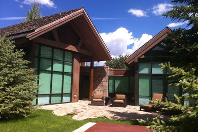 Photo of a large contemporary backyard patio in Denver with no cover.
