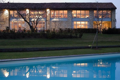 Inspiration for a country exterior home remodel in Milan