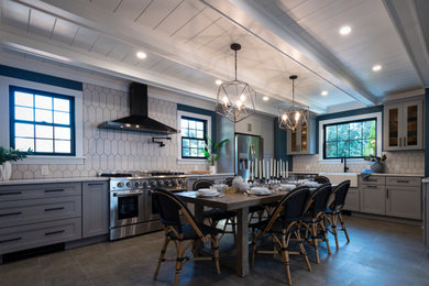 Large transitional l-shaped gray floor and shiplap ceiling eat-in kitchen photo in Philadelphia with a farmhouse sink, white cabinets, white backsplash, no island, white countertops, stainless steel appliances, shaker cabinets, quartz countertops and ceramic backsplash
