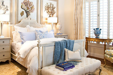 Mid-sized traditional guest bedroom in Dallas with white walls and medium hardwood floors.