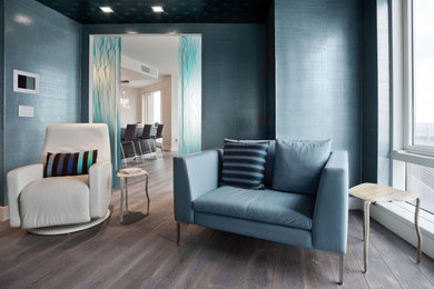 Example of a dark wood floor laundry room design in New York