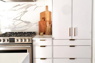 Eat-in kitchen - modern l-shaped porcelain tile and gray floor eat-in kitchen idea in Ottawa with an undermount sink, flat-panel cabinets, white cabinets, quartz countertops, white backsplash, porcelain backsplash, stainless steel appliances, an island and white countertops