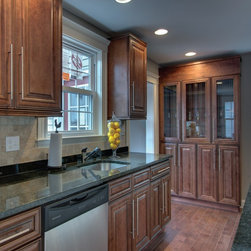 Chocolate color maple tall cabinets - Kitchen Cabinetry