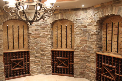 Example of a huge classic wine cellar design in Denver