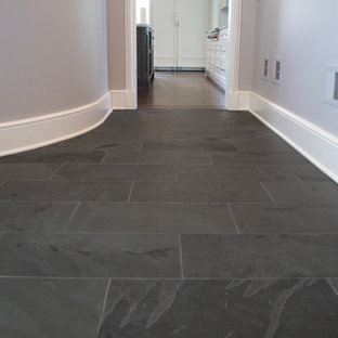 Example of a large classic slate floor hallway design in Chicago with gray walls