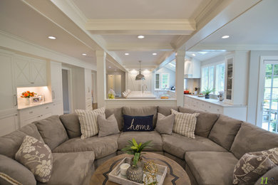 Large transitional u-shaped medium tone wood floor and brown floor open concept kitchen photo in Boston with a farmhouse sink, recessed-panel cabinets, white cabinets, quartzite countertops, gray backsplash, glass tile backsplash, paneled appliances, an island and white countertops