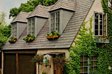 Small traditional beige two-story stucco exterior home idea in Chicago