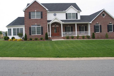 Mid-sized two-story mixed siding exterior home idea in Philadelphia
