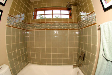 Photo of a mid-sized modern kids bathroom in Seattle with glass tile.