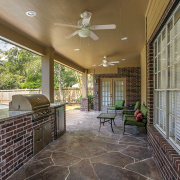 Stone Patio with Outdoor Kitchen and Pool