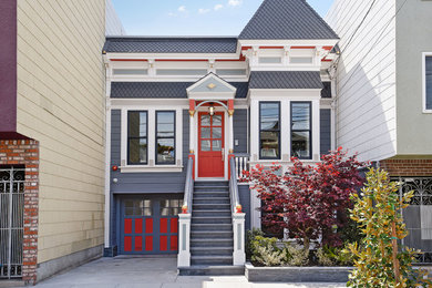 Design ideas for a transitional two-storey grey house exterior in San Francisco with vinyl siding.