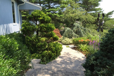 Photo of a traditional side yard landscaping in New York.
