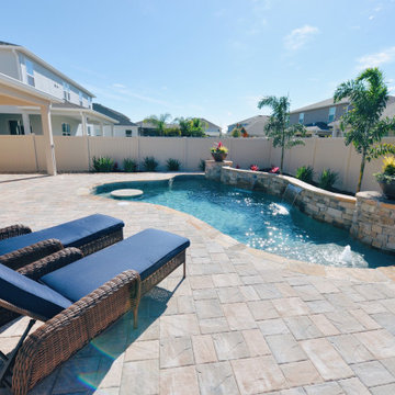 Custom Swimming Pool with Granite Tabletop and Spillway