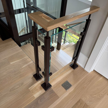 Project #136 | Modern Floating Staircase Encircling Glass Elevator