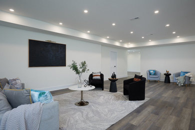 Example of a large gray floor living room design in DC Metro with white walls