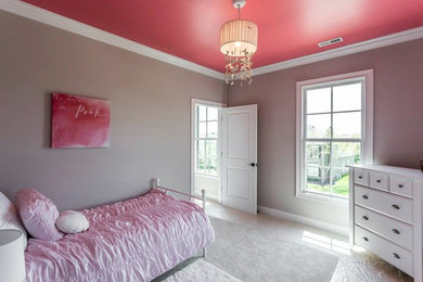 Inspiration for a large timeless guest carpeted bedroom remodel in Other with gray walls and no fireplace