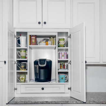 A modern Fusion Blanc kitchen with a built in coffee station