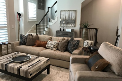 Inspiration for a mid-sized country dark wood floor and brown floor living room remodel in Dallas with beige walls
