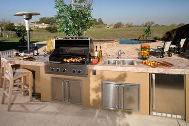 Inspiration for a large timeless backyard patio kitchen remodel in San Diego with no cover