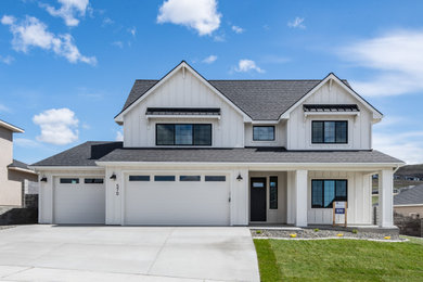 Example of a farmhouse exterior home design in Seattle