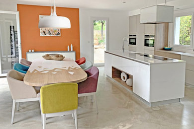 Inspiration for a contemporary open plan kitchen in Other with light wood cabinets, wood benchtops and with island.