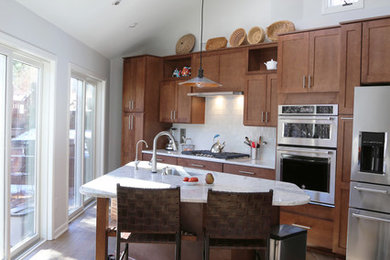 Trendy kitchen photo in Other with a drop-in sink, marble countertops, white backsplash, ceramic backsplash, stainless steel appliances and an island