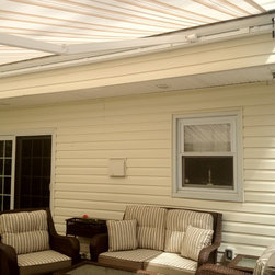 Striped Awning with a straight Valance. - Awnings