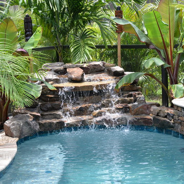 Pool and spa with Rock Water Features in Davenport, Florida