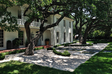 Inspiration for a large contemporary shade backyard stone formal garden in Austin.