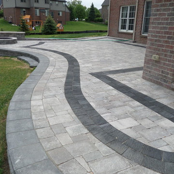 Raised Patio made with Unilock's Pisa Wall, Brussels and lL Campo Pavers