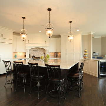 Open Kitchen with Off White Cabinets and Seating for Six