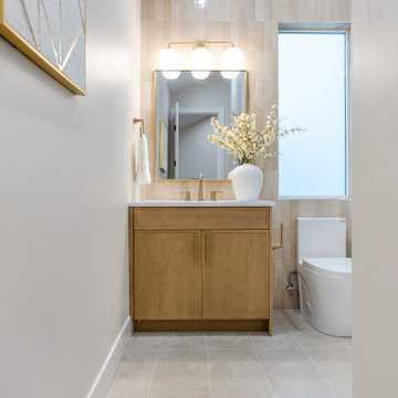 Powder Room with Blush Vertical Tile, White Oak Vanity and Brass – Bothell