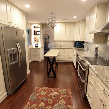 Medallion Painted White Chocolate Kitchen Cabinets with Petal Mosaic Backsplash