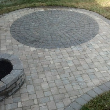 Cobblestone patio w/ circle and planter