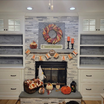 Built in Cabinets with Bookshelves and Mantel Surround. Crown Molding.