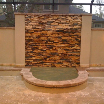 Privacy wall with natural pond