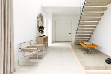 Design ideas for a large modern hallway in Hamburg with white walls and white floor.