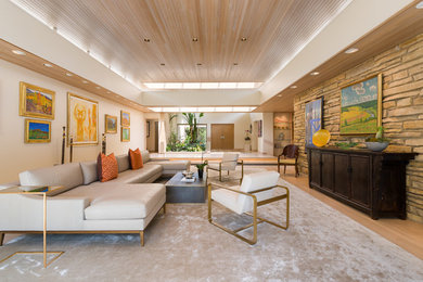 Example of a mid-sized trendy formal and open concept light wood floor and beige floor living room design in Chicago with white walls, no fireplace and no tv