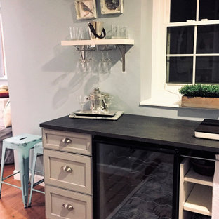Small vintage walk-out basement in DC Metro with blue walls, vinyl flooring and brown floors.