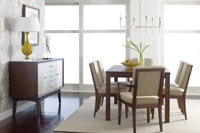 Example of a large trendy dark wood floor and brown floor great room design in Salt Lake City with white walls and no fireplace