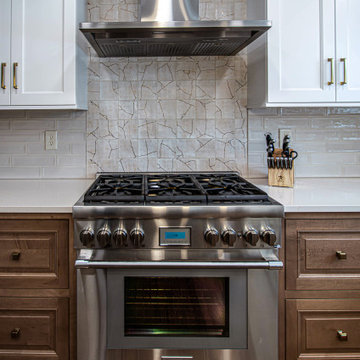 Two Tone Kitchen with Floating Shelves and Island Seating and Updated Fireplace