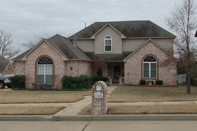 Inspiration for a red two-story mixed siding exterior home remodel in Other