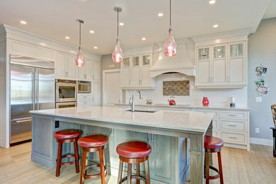 Example of a transitional kitchen design in Calgary