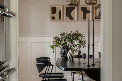 Mid-sized transitional light wood floor, coffered ceiling and wallpaper kitchen/dining room combo photo in Chicago