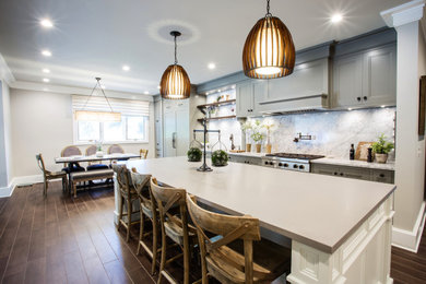 Example of a large mid-century modern galley porcelain tile and brown floor kitchen design in Other with gray cabinets, concrete countertops and marble backsplash