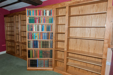 Run of bookcases, showing the hidden door standing open.